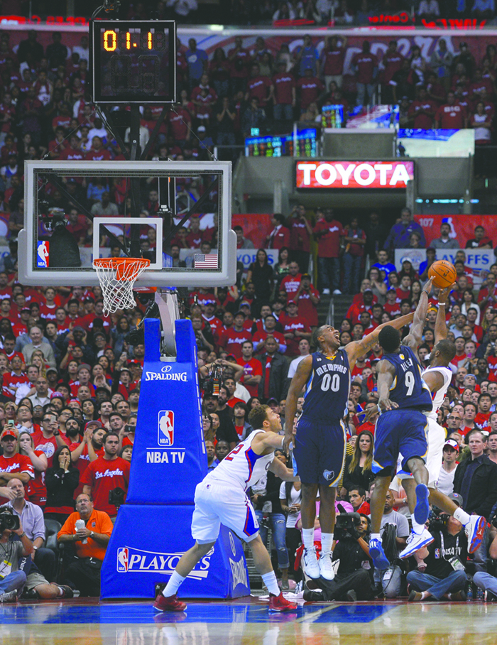 Associated Press Clippers guard Chris Paul scores the game-winning basket against Memphis on Monday night.