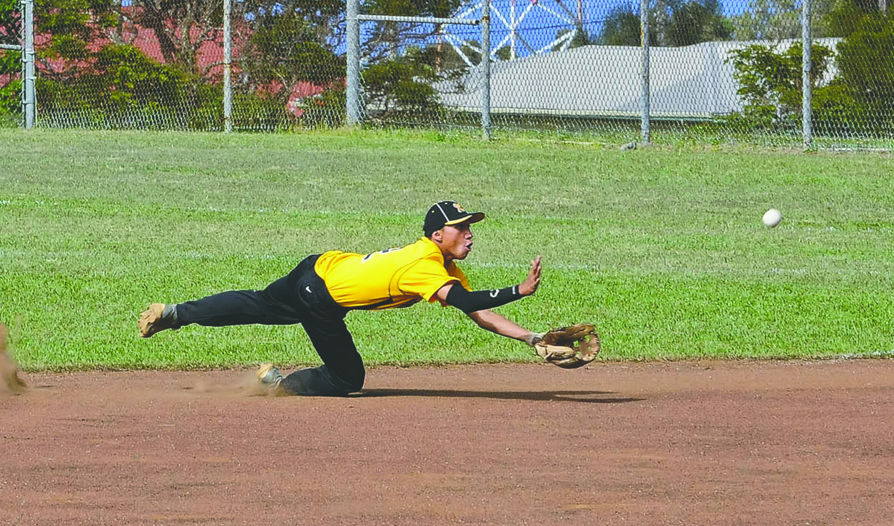 BRAD BALLESTEROS/Tribune-Herald Kohala's Kainalu Solomon makes a diving catch for an out.