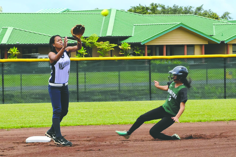 BRAD BALLESTEROS/Tribune-Herald Kamehameha's Namele Naipo-Arsiga waits to make a putout as Konawaena's Shyla Victor comes sliding in.ile Kona's S. Victor #5 comes sliding in.