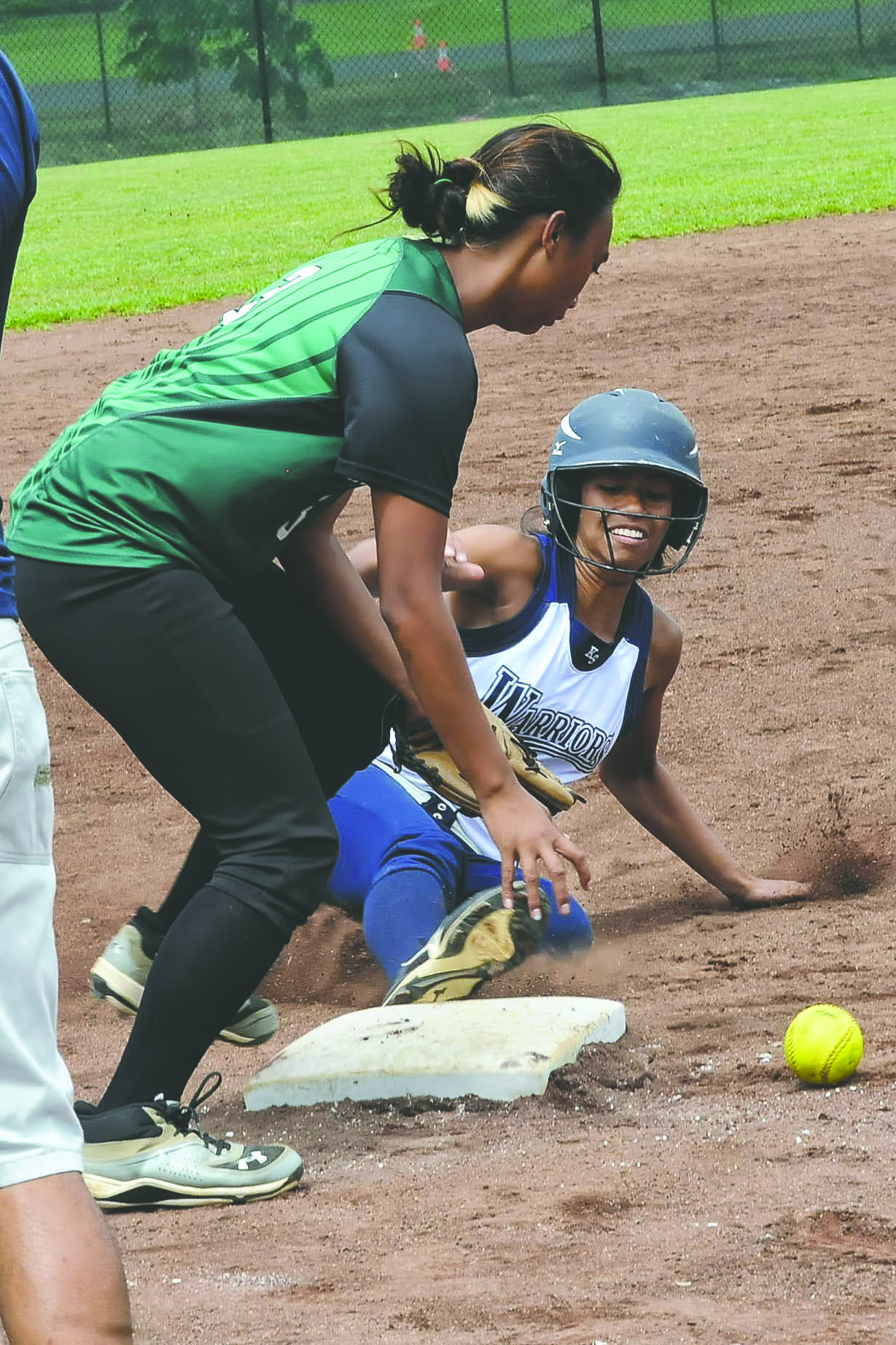 BRAD BALLESTEROS/Tribune-Herald Kamehameha's Namele Naipo-Arsiga slides safely into third base on Saturday against Konawaena.