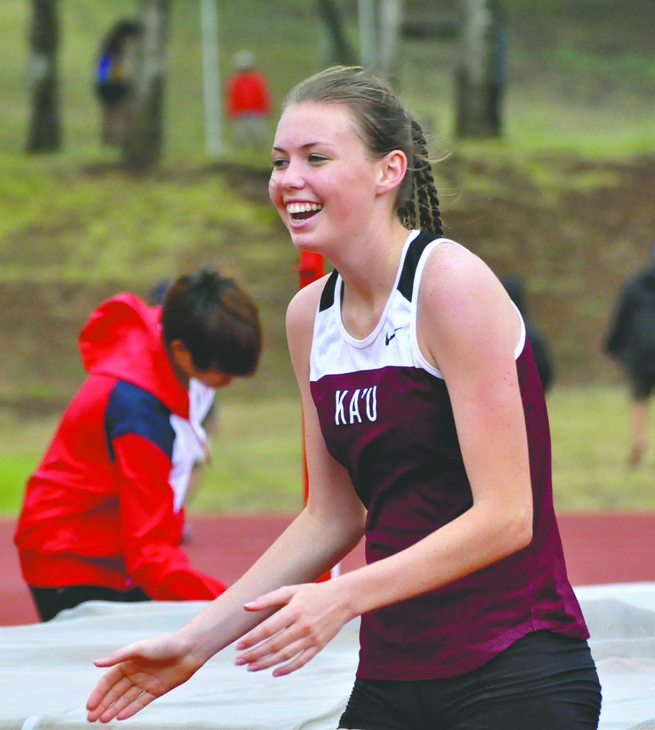 JARED FUJISAKI photo Ka'u's Marley Strand-Nicolaisen had three reasons to smile at the BIIF track and field championships: gold in alll three jumps.