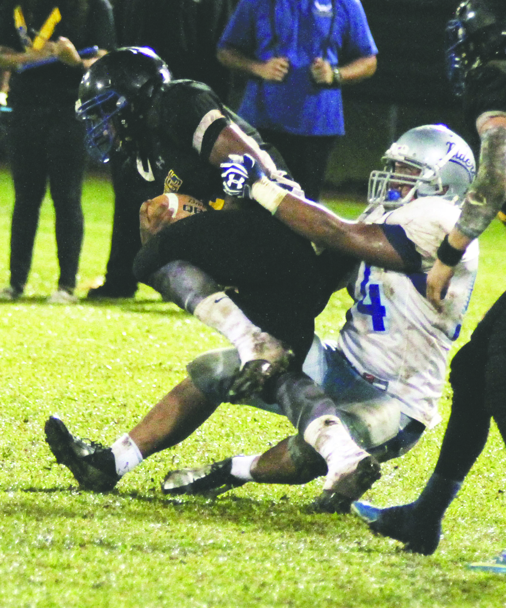 TIM WRIGHT/Tribune-Herald Kealakehe's Howard Cosare brings down Hilo's Tristin Spikes on Saturday night during the Vikings' 6-3 victory.