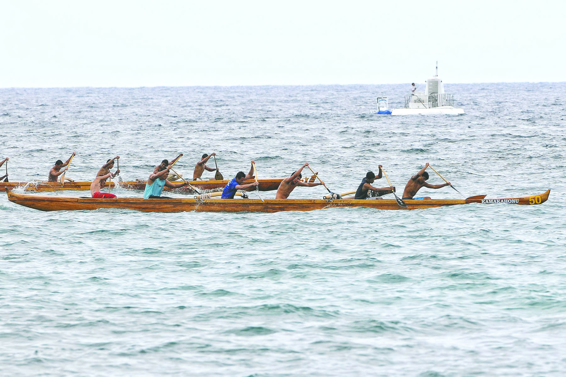 BRAD BALLESTEROS/Stephens Media Kai Opua boys 16 crew captures the half-mile race Saturday during the Founders Regatta in Kailua Bay.