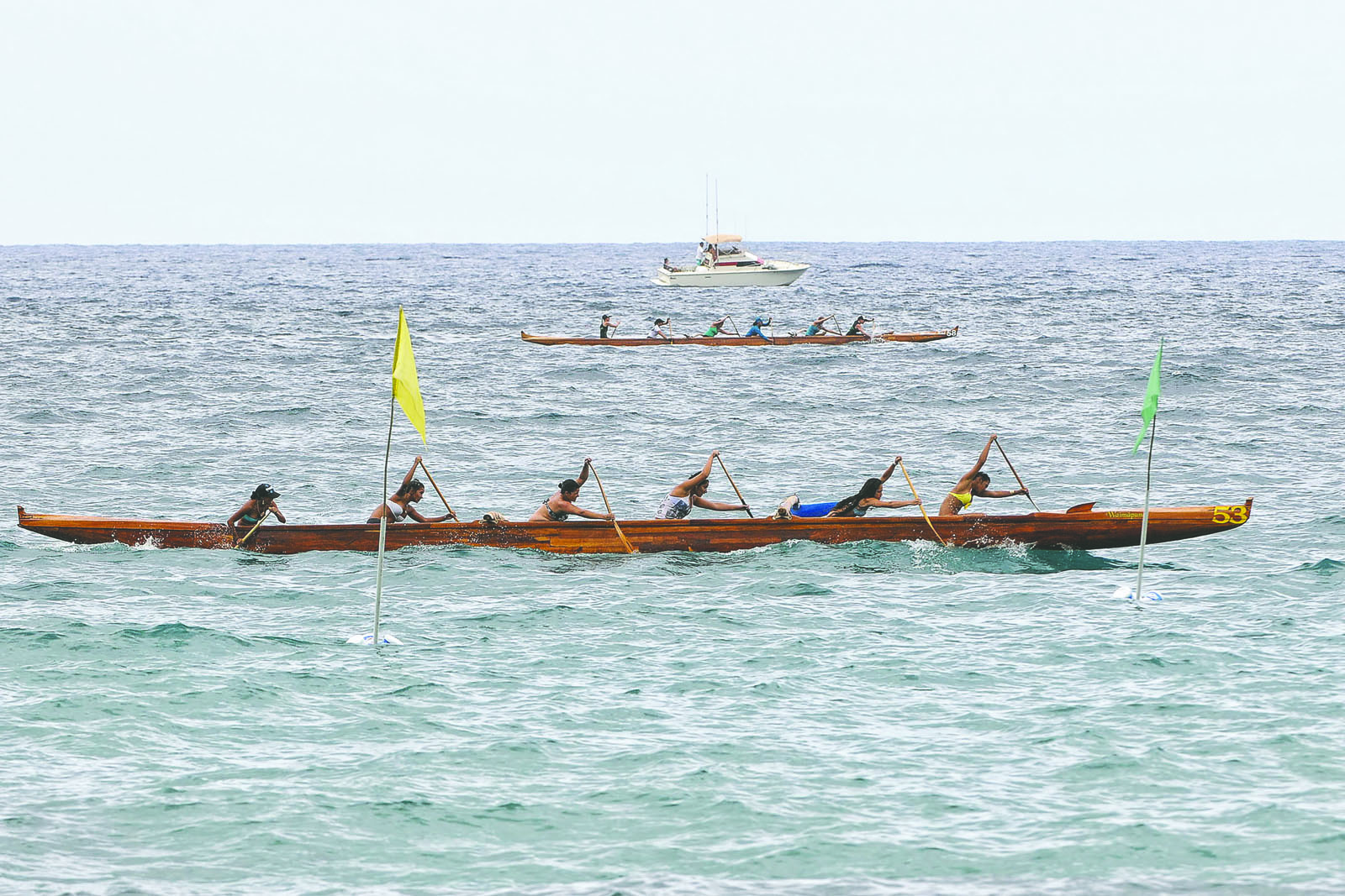 BRAD BALLESTEROS/Stephens Media Keaukaha Canoe Club's girls 16 crew wins its half-mile race Saturday during the Founders Regatta in Kailua Bay.