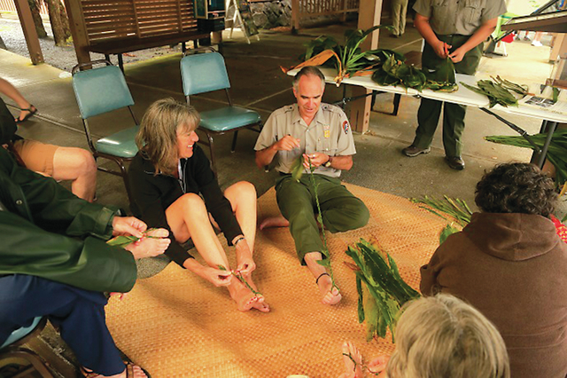 3534297_web1_Ranger-Dean-demonstrating-ti-leaf-lei-making_688.jpg