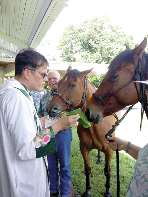 4212590_web1_Father-Moki-Hino-perfroming-animal-blessing-2015.jpg