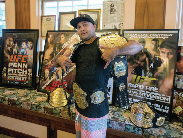 4281141_web1_1-BJ_Penn_with_UFC_Belts_2.jpg