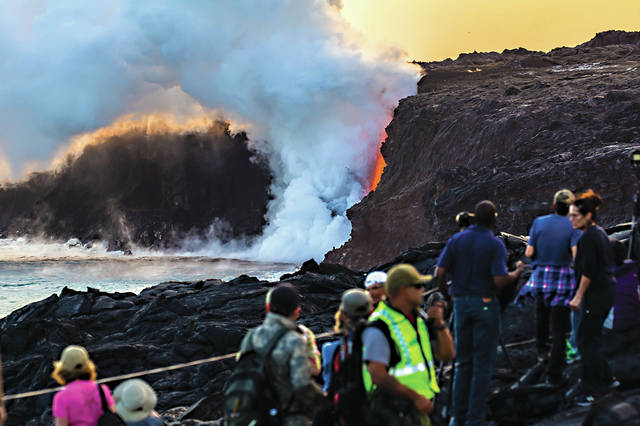 5715628_web1_Eruption-crew-ranger-ensures-visitor-safety-at-Kamokuna-2.24.17.jpg