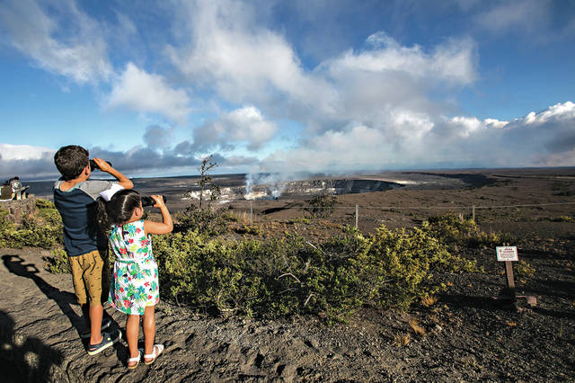 5715628_web1_Keiki-looking-at-lava-lake-at-Kilauea-summit-from-Jaggar-Museum.jpg