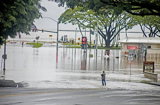 Day of deluge: Road closures, flood warnings in place; more rain ...