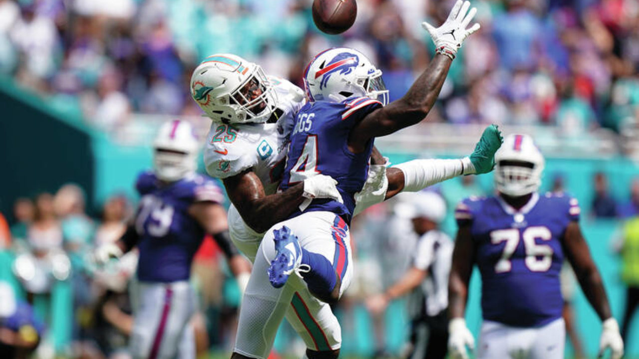 Miami Dolphins wide receiver Trent Sherfield (14) runs a play