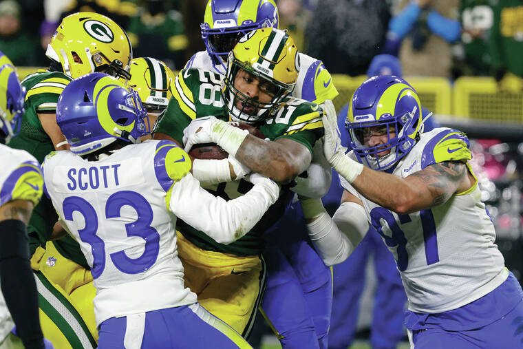 AJ Dillon helps Packers beat Rams to keep playoff hopes alive