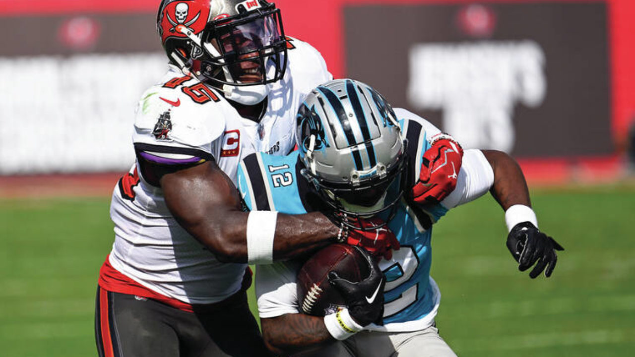 Tom Brady, Bucs rally to beat Panthers 30-24, clinch NFC South