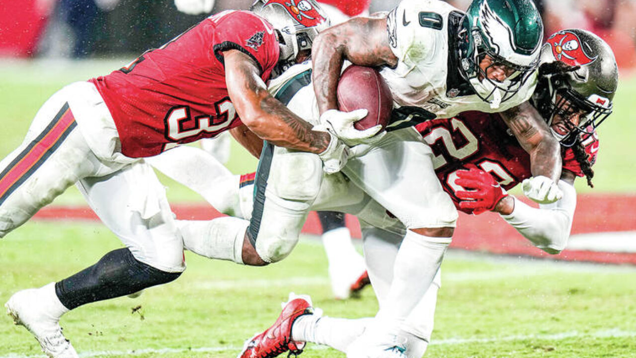 Philadelphia Eagles quarterback Jalen Hurts puts a pass only wide receiver Olamide  Zaccheaus could catch for a 34-yard TD