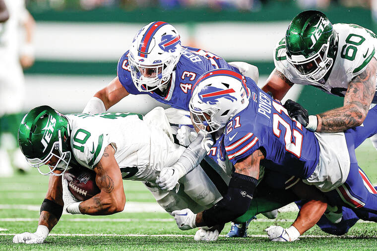 Aaron Rodgers injures Achilles, New York Jets beat Buffalo Bills in overtime