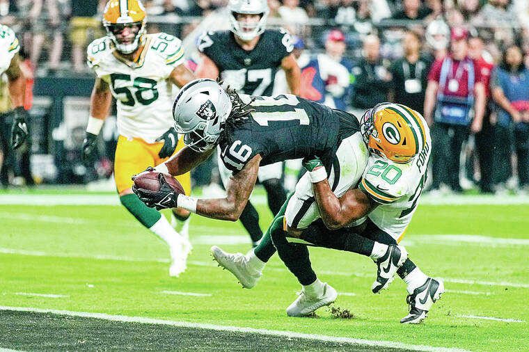 Green Bay Packers safety Rudy Ford (20) celebrates intercepting a