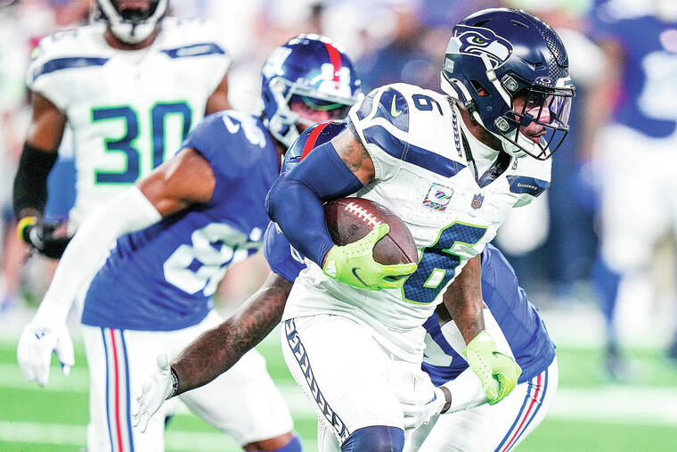 Rookie Devon Witherspoon scores on 97-yard pick six as Seahawks D leads  Seattle over Giants - Hawaii Tribune-Herald